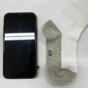 white socks with iphone X size comparison